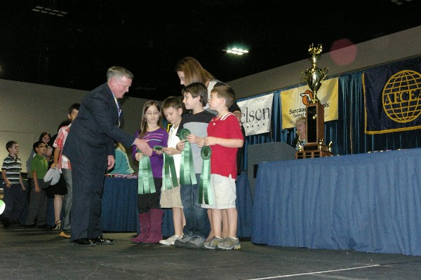 In February, the chapter sponsored the largest STEM fair in the state of Florida. Capt. Slevin (l) was on hand to recognize participants.